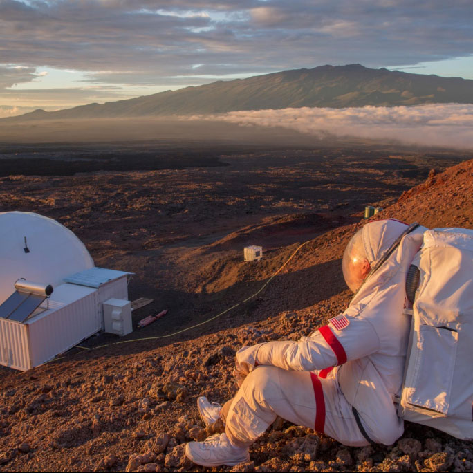 Image of astronaunt looking at mars like landscape on earth