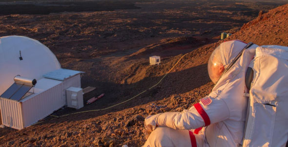 Image of astronaunt looking at mars like landscape on earth