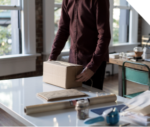 Person packing a box