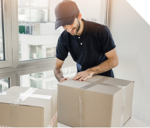 Person taping a box up